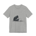 Campfire Reading Bear Unisex T-Shirt – Cozy Book Lover Graphic Tee